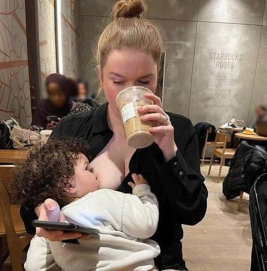 At first glance, it looks like a harmless photo of a woman breastfeeding her baby. Look closer, though, and you’ll see the hidden detail that caused this picture to go viral  Full story in the comments ..