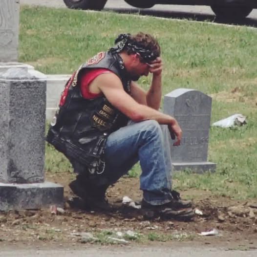 A biker showed up at my wife’s grave every week and I had no idea who he was. For six months I watched him from my car. Same day. Same time. Every Saturday at 2 PM he’d roll up on his Harley, walk to Sarah’s headstone, and sit there for exactly one hour. He never brought flowers. Never said a word that I could see. Just sat cross-legged on the ground next to her grave with his head bowed. The first time I saw him, I thought maybe he had the wrong grave. The cemetery’s big. People get confused. But he came back the next week. And the next. And the next. I started getting angry. Who was this guy? How did he know my wife? Why was he spending an hour every single week at her grave when some of her own family couldn’t be bothered to visit once a month? Sarah died fourteen months ago. She was forty-three. We’d been married twenty years. Two kids. A good life. A normal life. There was nothing in her past that would connect her to a biker. She was a pediatric nurse. She volunteered at church. She drove a minivan. Her idea of rebellion was putting an extra shot of espresso in her latte. But this guy, this biker, he was grieving her like he’d lost someone precious. I could see it in the way his shoulders shook sometimes. In the way he’d press his hand against her headstone before he left. It was driving me crazy. After three months, I couldn’t take it anymore. I got out of my car and walked over while he was there. He heard me coming. Didn’t turn around. Just kept his hand on Sarah’s headstone. “Excuse me,” I said. My voice came out harder than I meant it to. “I’m Sarah’s husband. Mind telling me who you are?” He was quiet for a long moment. Then he stood up slowly and said: “Your wife was my…… (continue reading in the C0MMENT)⤵️