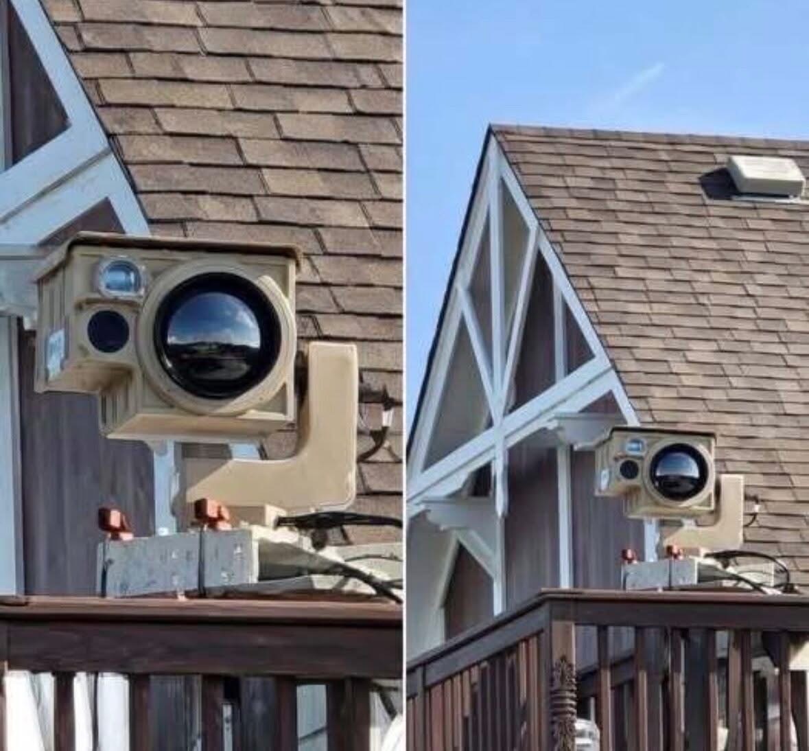Can anyone tell me what my neighbor just put up? There’s a brown box with a silver-on-black circle next to a big lens that swivels and plugs into electricity. Check the comments for more…