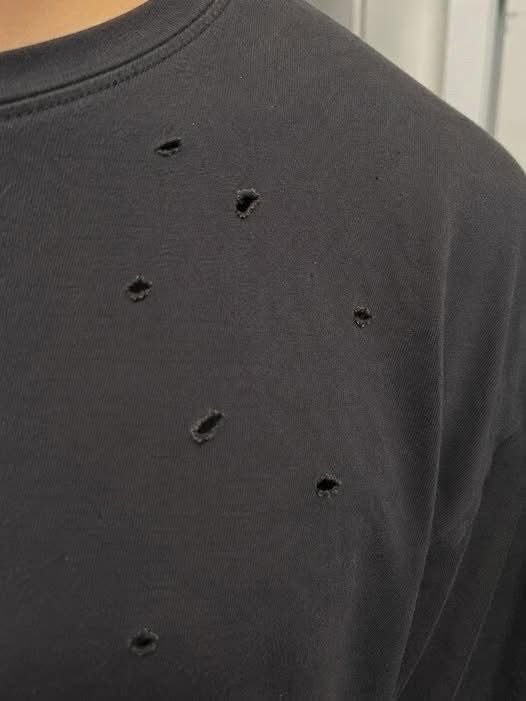 I’m losing my mind!!! What is causing these holes in my clothes? Some are tiny, while others are much bigger. They keep appearing on more and more of my clothes. 😱😱😱