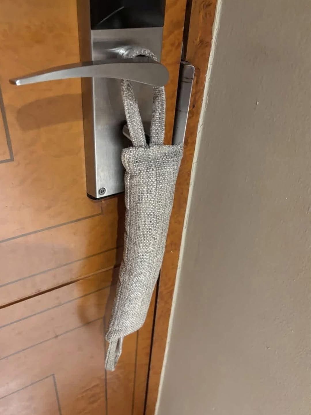 “I’m an airline pilot and have stayed in a bazillion hotels. First time I’ve seen one of these and I can’t for the life of me guess its function. Anyone know?! About a foot and a half long… doesn’t fit the span of the door… my first thought was to block noise or light under the door but it’s not long enough.”